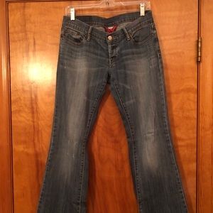 LUCKY BRAND low rise distressed boot cut jeans.